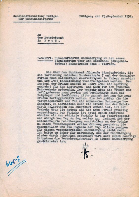 Holzbüttgen, Antrag des Gemeindedirektors von Büttgen 1952 an das Betriebsamt der Reichsbahn in Neuss zwecks Sicherung des unbeschrankten Bahnübergangs an der Gümpgesbrücke, der durch die Verkehrszunahme zu einem Gefahrenpunkt erster Ordnung geworden ist.